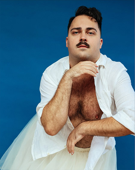 Beau Harmon posed jauntily in white flowing clothes