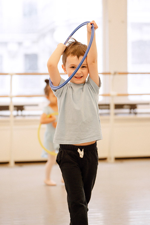 young boy dancer with hoop
